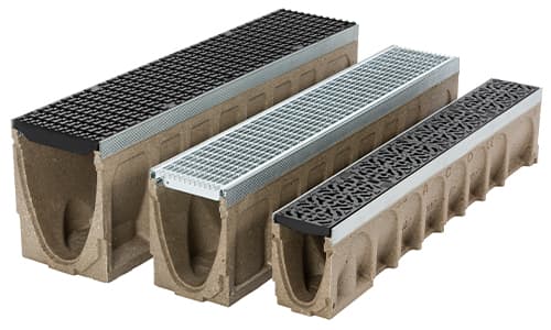 ACO MultiDrain polymer concrete channel drain sections with heavy-duty grates for highway and infrastructure surface water drainage